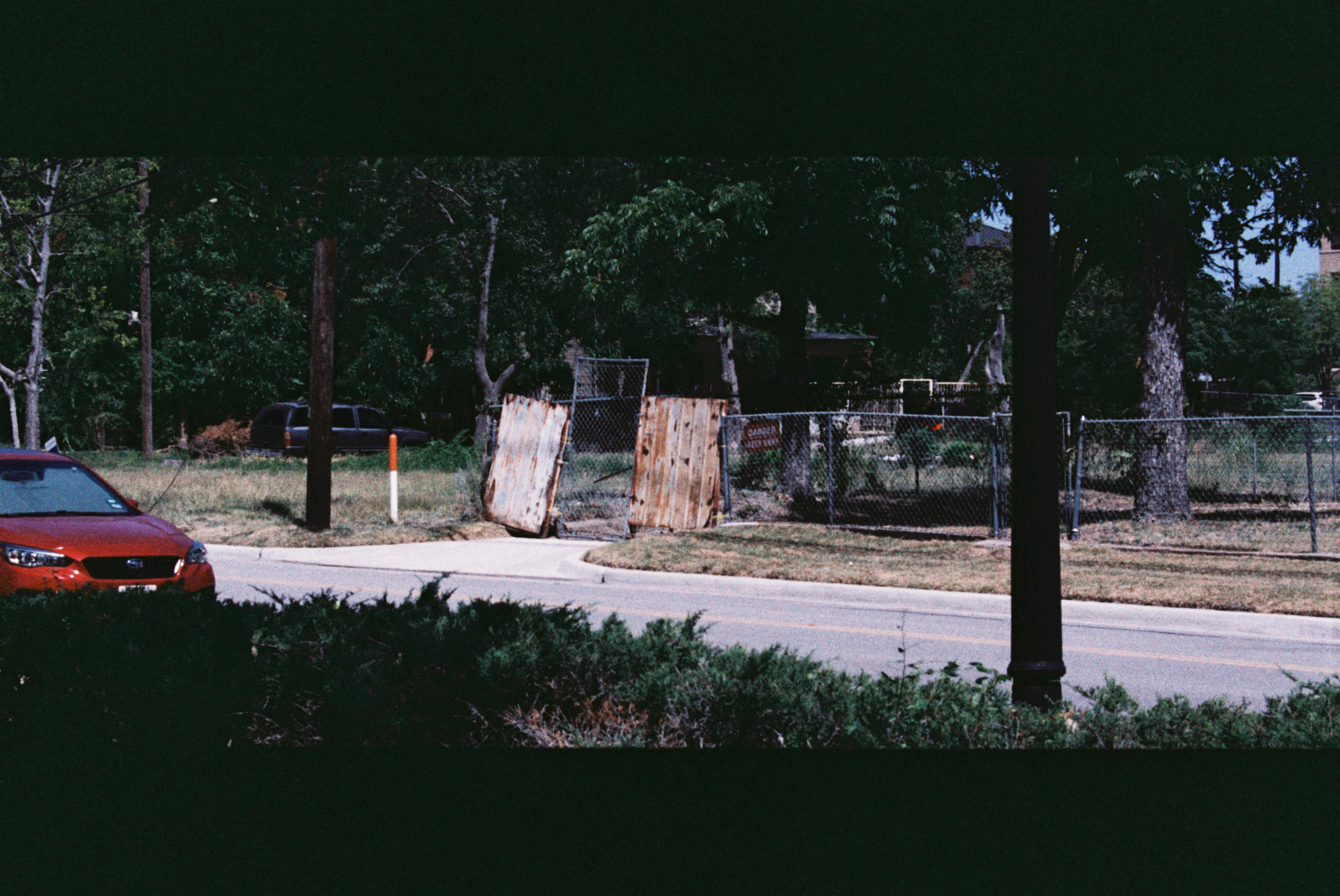 A musician playing a guitar on a dimly lit stage.
